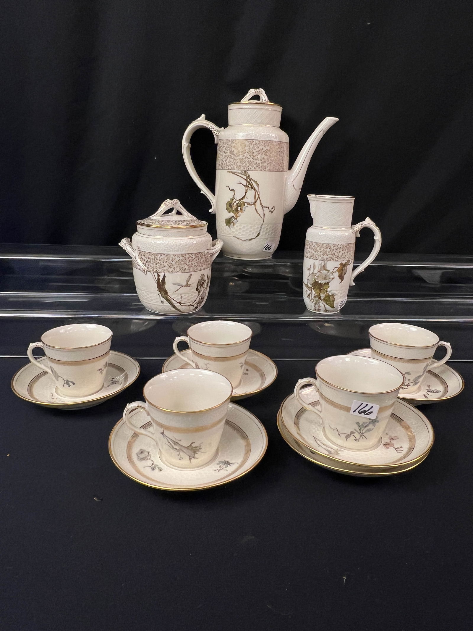Haviland Limoge Alice Pattern Tea Service C.1885: An antique Haviland Limoges tea service in the Alice pattern 1885.Set include one large coffee pot, creamer, covered sugar, five cups, six saucers. Set is decorated with floral and dragonflies. Coffee