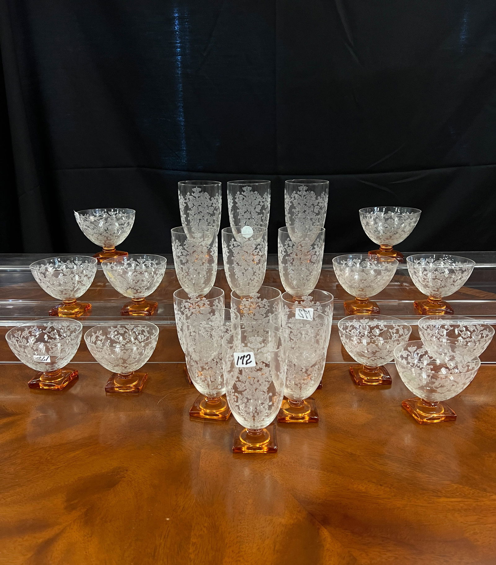 Fostoria Queen Anne Pattern Stem Wear: Fostoria Queen Anne stem wear in amber bases in an art deco style. To include 12 sherbet, 21 waterglasses