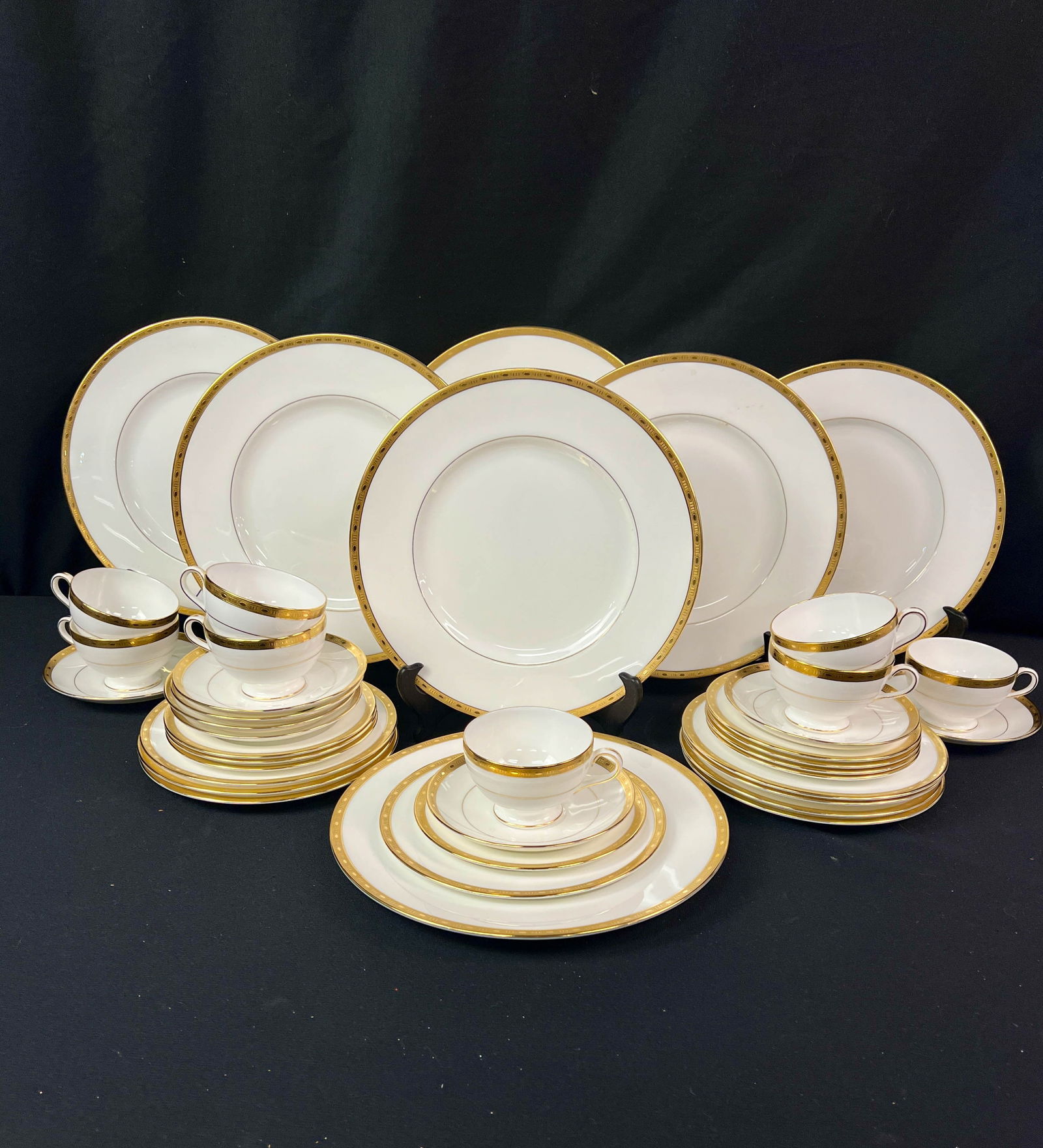 Minton Winchester Pattern K-132 Dinner Service for 7: A Minton China Winchester Pattern k-132 originally sold through George Watts Milwaukee consisting of gold rimmed porcelain dishes that include 8 cups, 8 saucers, 8 desert plates, 8 luncheon plates, an