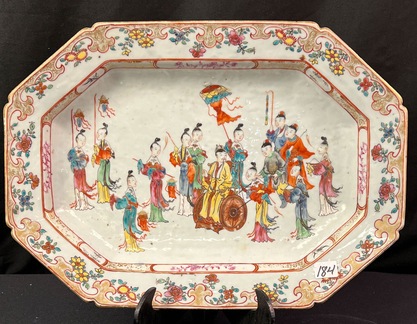18th Century Chinese Export Octagon Platter: 18th century Chinese export Octagon platter depicting a presession with noble man in a sedan with an elaborate floral border. It measures 2" x15.5" x 11"