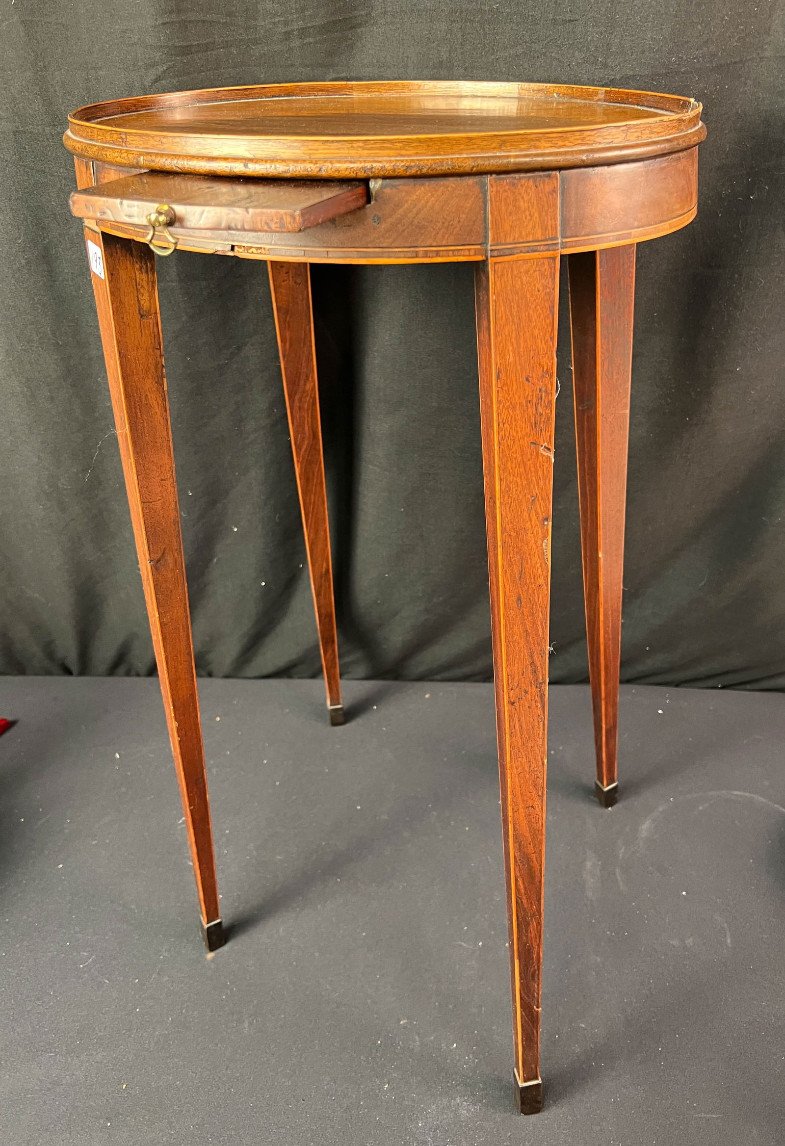 18th Century Mahogany Candle Table: An 18th century mahogany candle table with pullout candle holder with splayed legs banded inlays and lipped edge top. This wonderful early candle table measures 26" x 14" x 10" (Minor losses noted). E