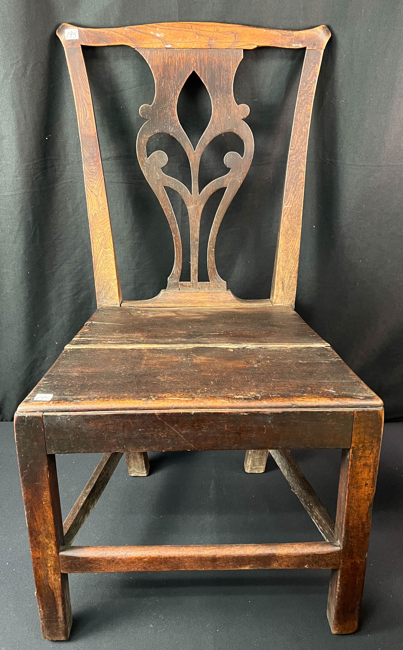 American Chippendale Side Chair c.1750: A colonial American lyre back Chippendale mahogany chair with plank seat c.1750. This chair appears to be in original finish. There have been repairs to the top and seat, but overall it is in good con