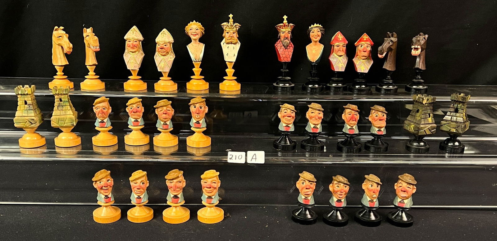 A Black Forest Chess Set: A complete hand carved Black Forest German chess set.