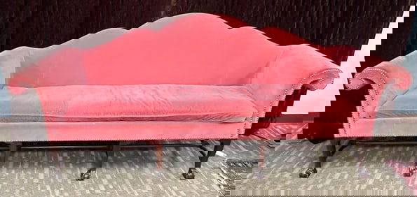 An Exaggerated Camel Back Sofa With Four Mahogany Claw Feet