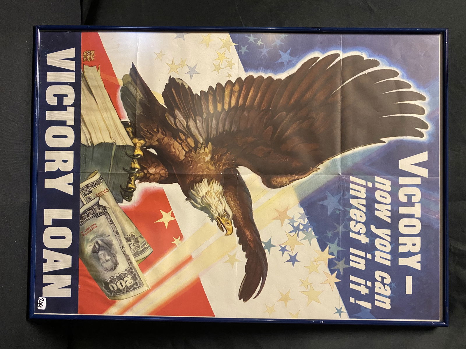 Victory Loan WWII Poster: An original war bonds poster depicting an American eagle promoting war bonds with the description "Victory - now you can invest in it! VICTORY LOAN". It measures 26" tall x 18.5" across.