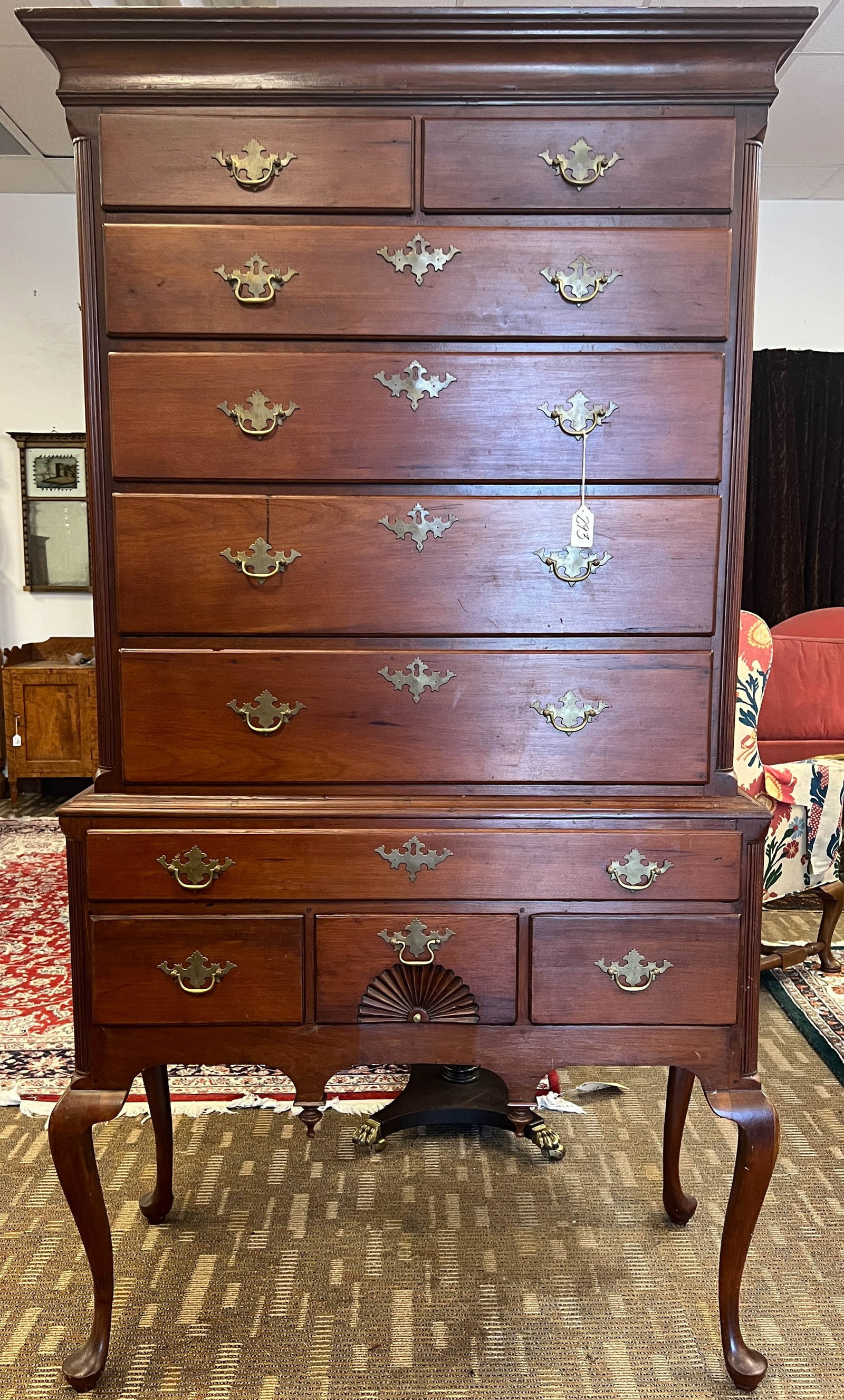 A 18th Century Cherry Chippendale Flat Top Highboy: A 18th century cherry Chippendale flat top highboy with shell carving. It has 10 drawers with fluted column sides and flat molded overhanging top. This chest appears to have its original hardware and