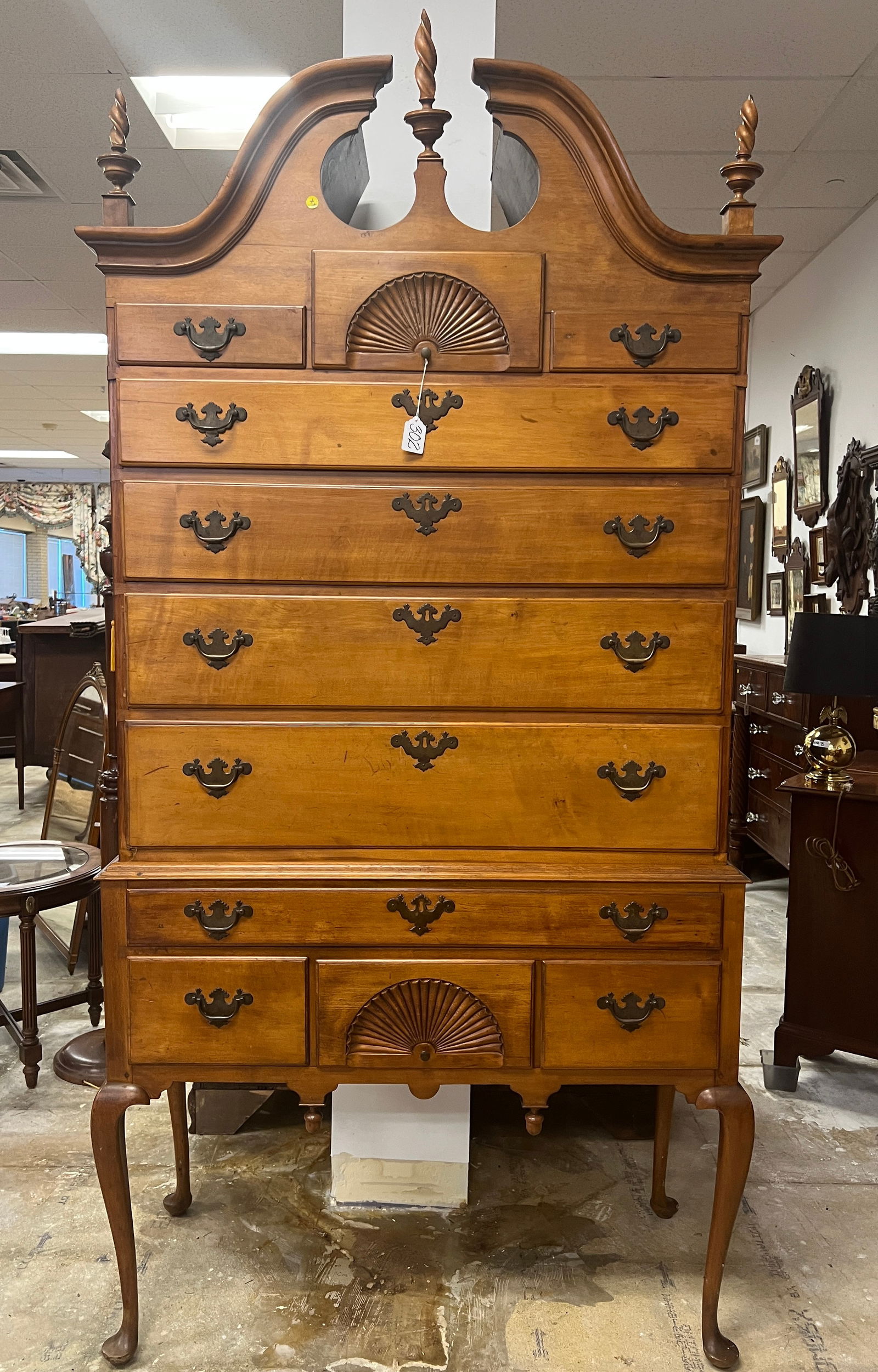 Antique 18th Century Bonnet Top Chippendale Highboy In Cherry: A quality handmade 18th century cherry bonnet top Chippendale highboy with shell carving, Queen Anne legs, acorn and flame finials. It is all original with 11 drawers. This chest is of superior crafts