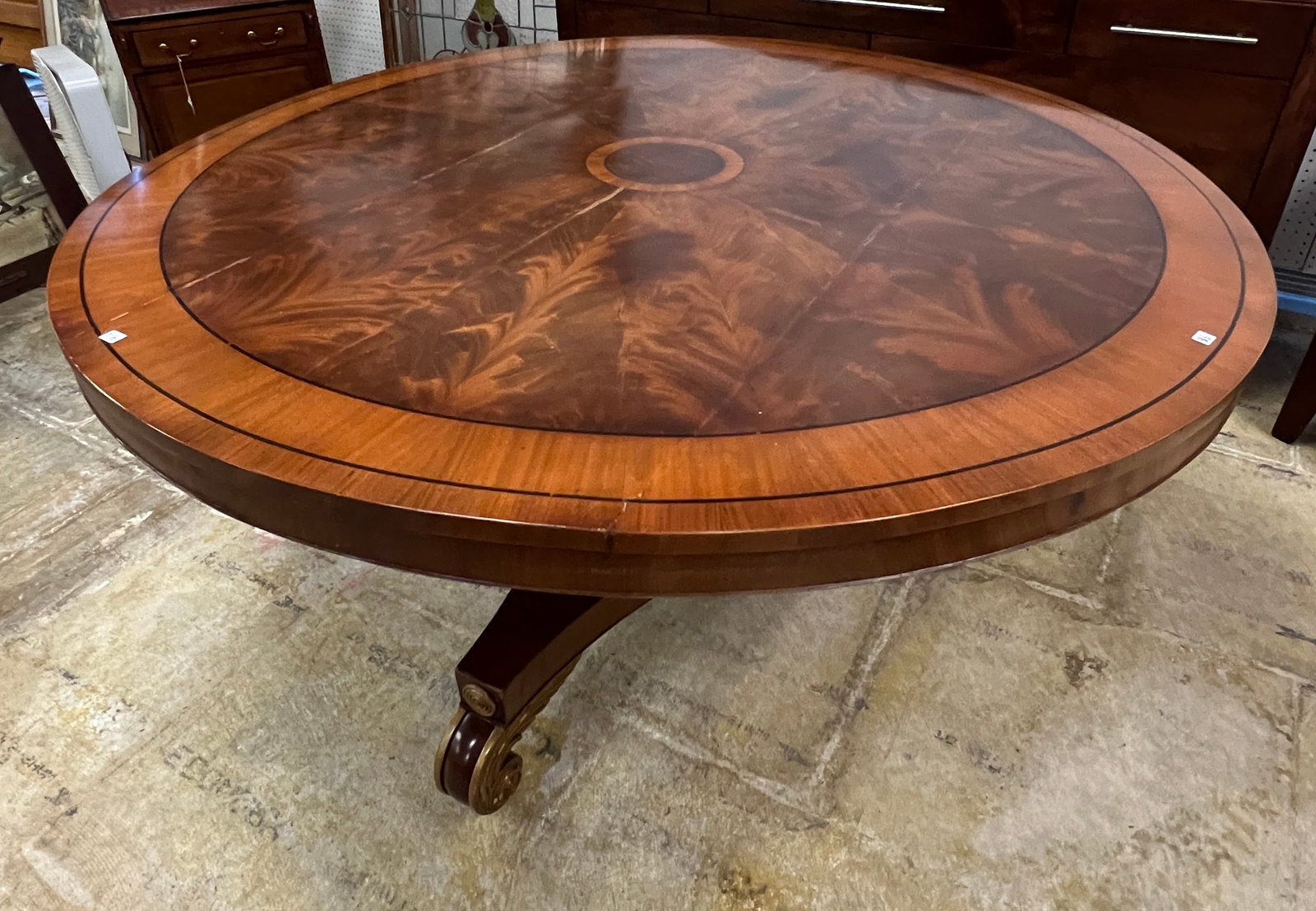 Immense Mahogany Round Tilt Topped Table c1780: An immense mahogany round tilt topped table c1780 with acanthus carved feet, banded inlays, and flamed mahogany center. This early flip top dining table is a masterpiece of woodworking (Unfortunately