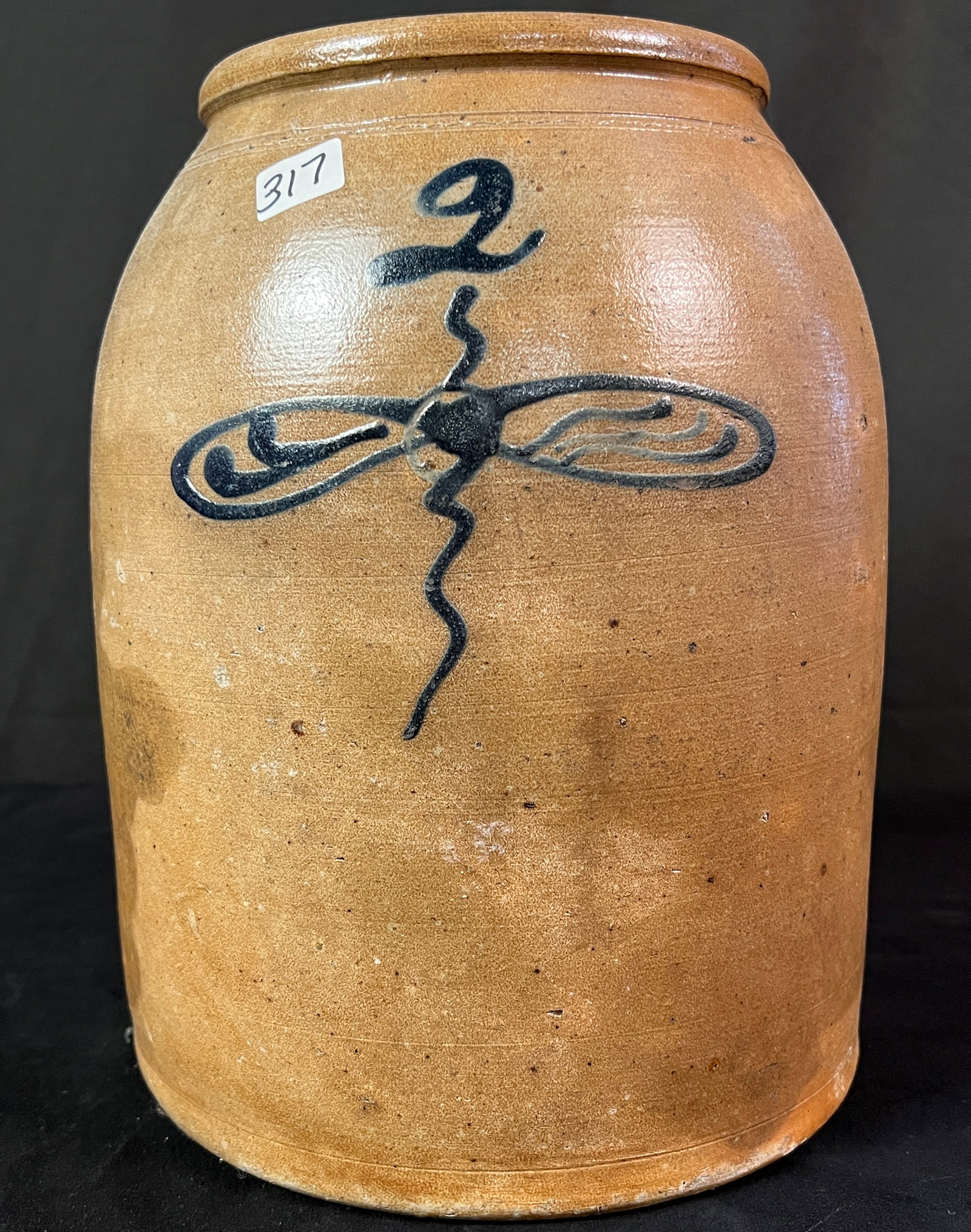 A Beehive Stoneware Two Gallon Crock With Decoration: A beehive two gallon decorated crock depicting a bumblebee. It is in excellent condition and it measures 11" x 8.25"