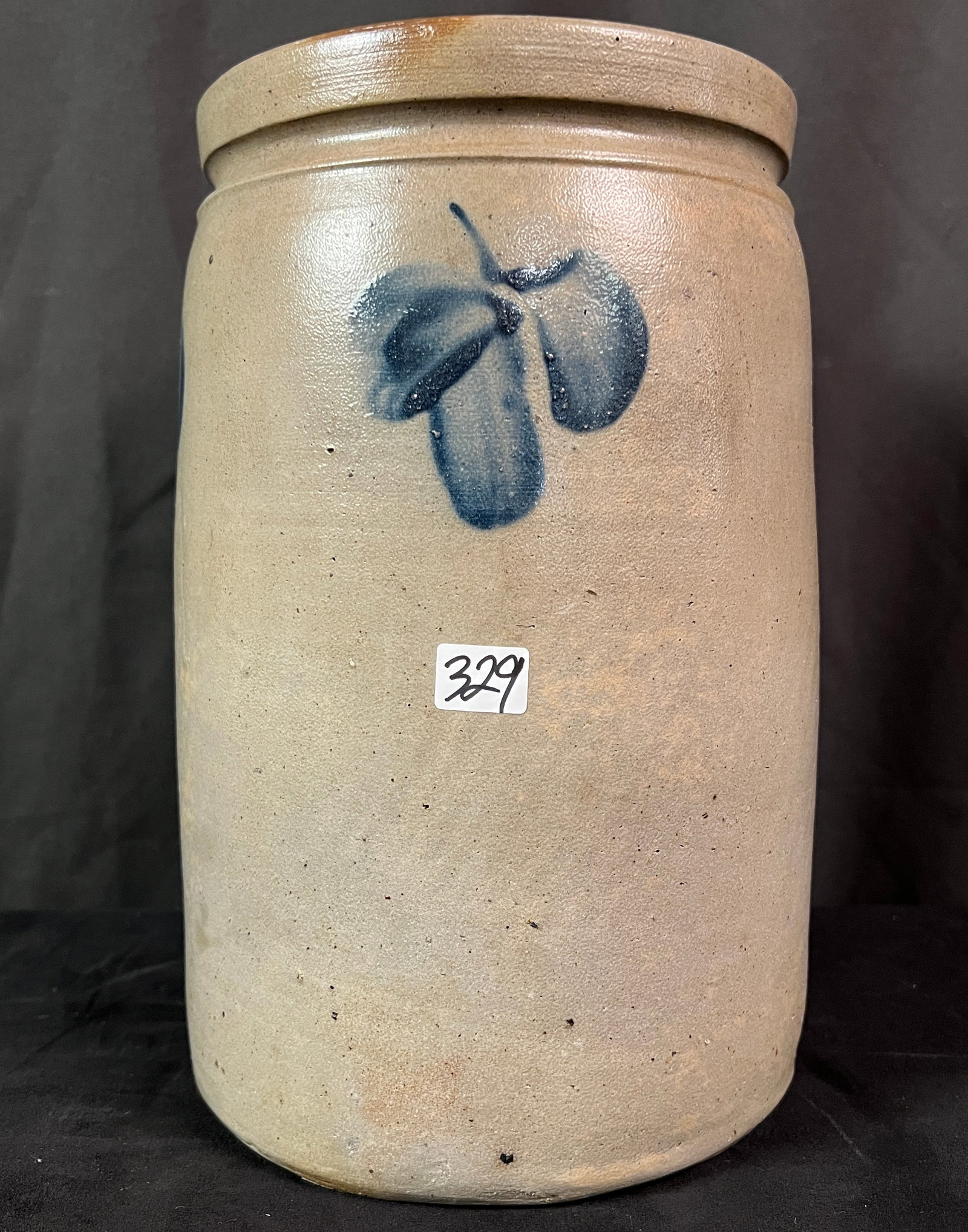 Two Storage Crocks One By C. Hermann & Co. Milwaukee: Two antique storage crocks one by crock maker Charles Hermann of Milwaukee in excellent condition and it measures 9.75" x 5.75" round. A wonderful blue and gray stoneware storage crock with clover dec