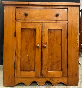 An Early Pine Single Drawer Over Double Door Cabinet