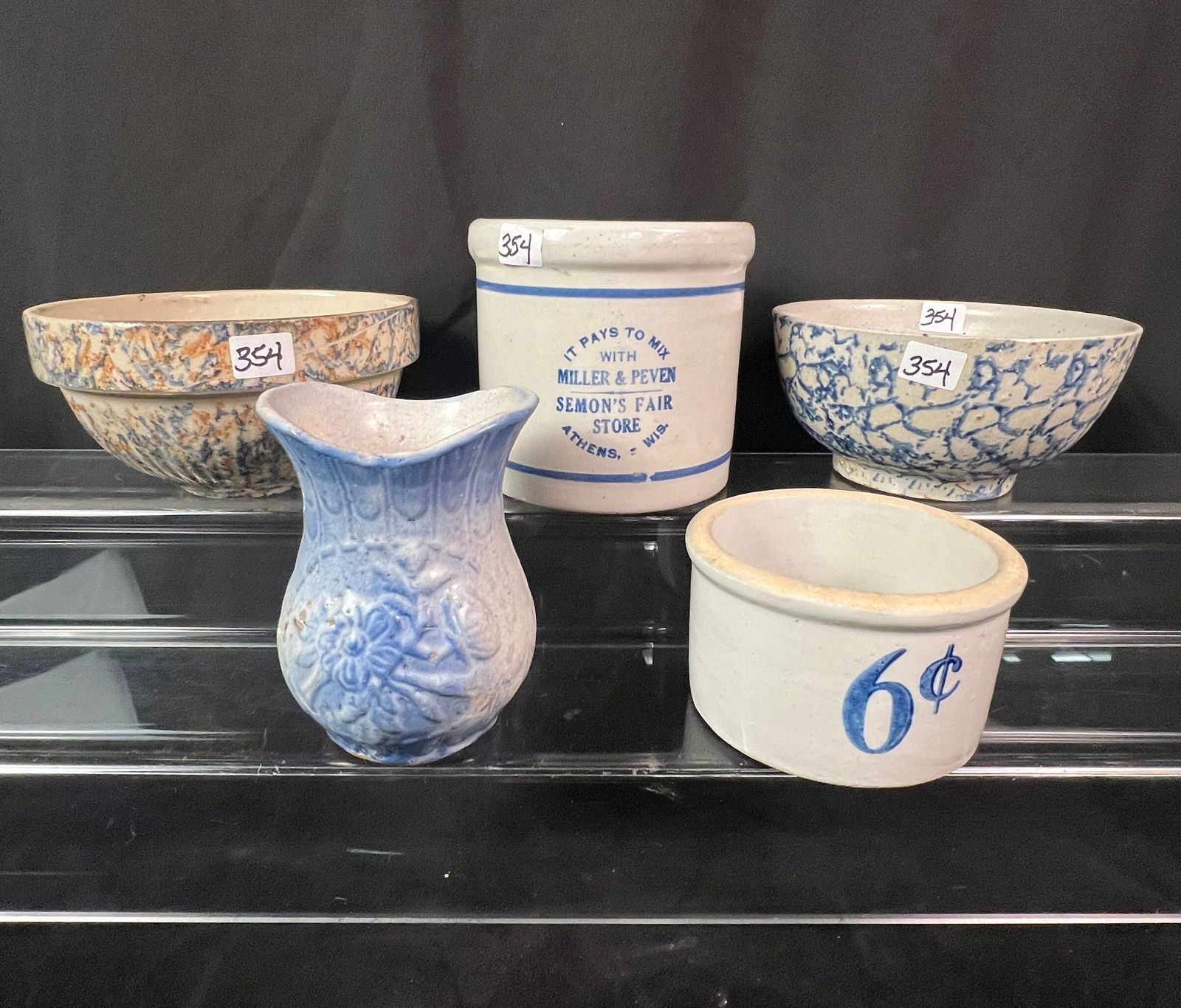 Five Pieces of Stoneware To Include Advertising, Mixing Jar, and More: Five pieces of stoneware to include advertising beater jar that reads "It pays to mix with Miller and Peven Semon's Fair Store Athens, Wisconsin" it measures 4" x 5". A six cent stoneware butter jar t