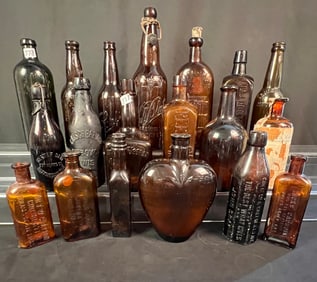 A Collection of 21 Antique Bottles To Include Medicine, Whiskey, and Beer