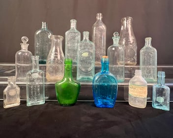 A Collection 16 of Antique Milk and Medicine Bottles
