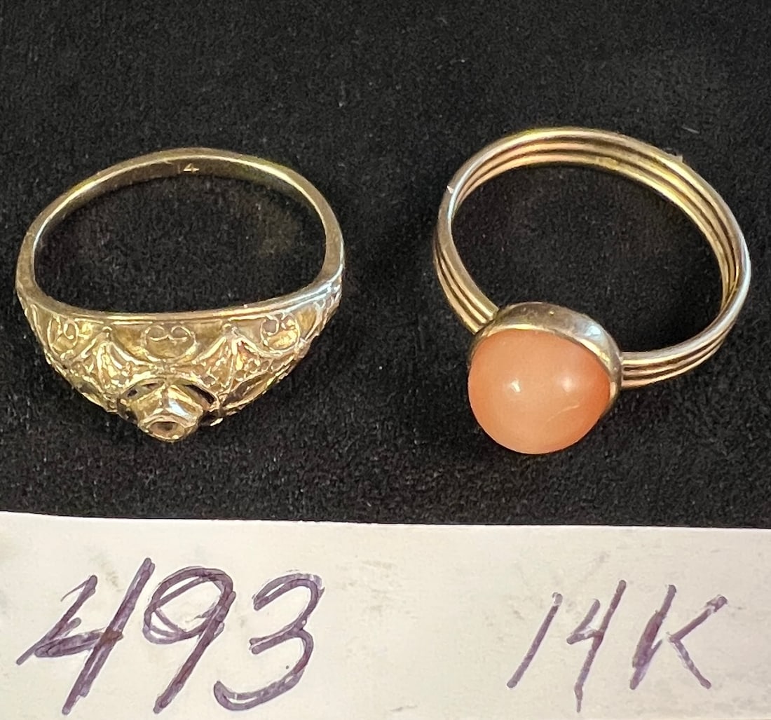 Two Yellow 14K Gold Rings: Two yellow 14K gold rings. One with moonstone that measures 6.75, the other with fancy filigree that measures 4.25. Together they weight 4.63g with stone or 0.16oz that equals in scrap roughly $283.