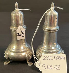 A Pair of Sterling Salt & Pepper Shaker with Lions Head