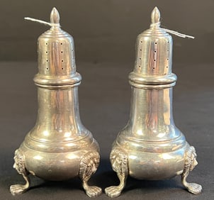 A Pair of Sterling Salt & Pepper Shaker with Lions Head