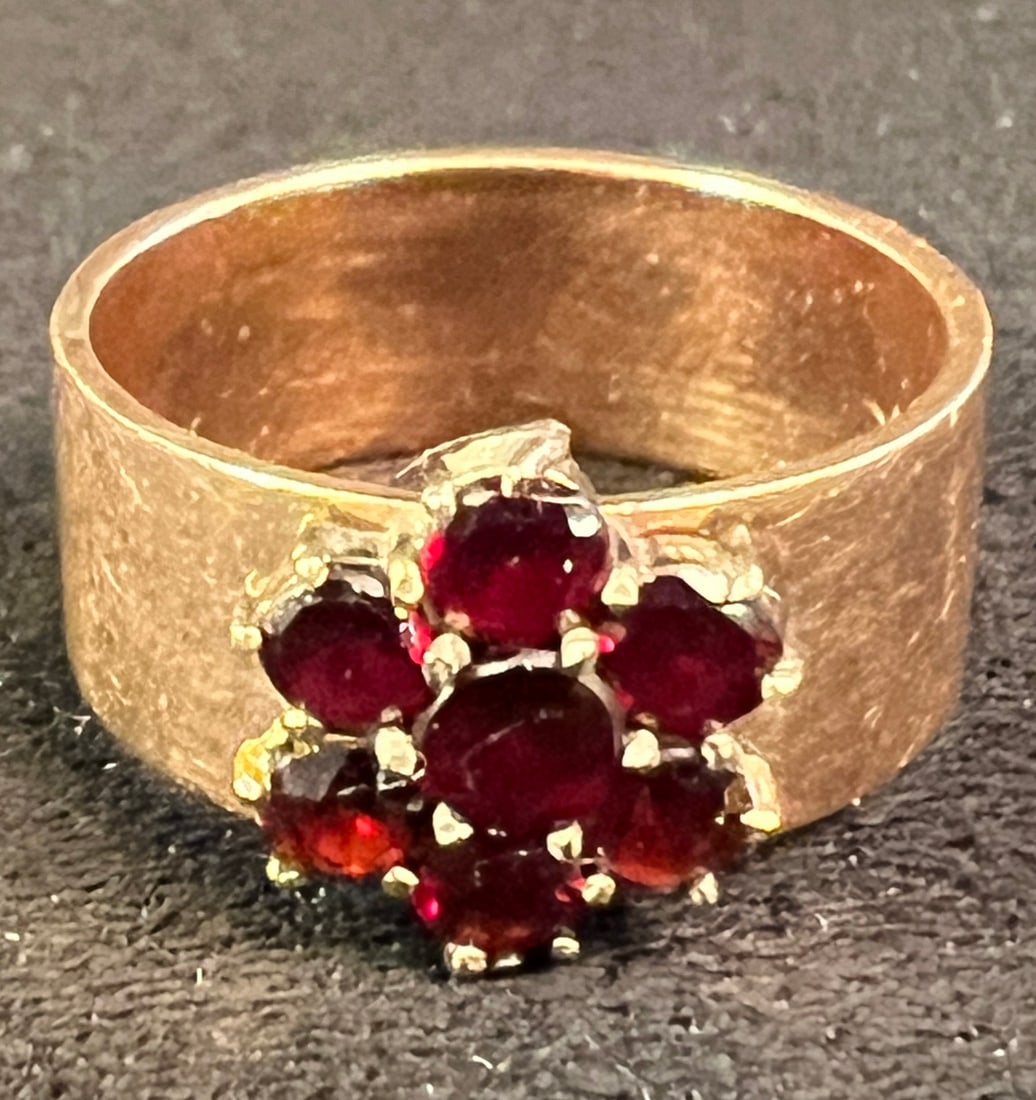 18K Garnet Cigar Band Ring: An antique 18K and garnet cigar band ring. Ring is a size 6.5 - 7 and weighs approximately 4.4 grams.