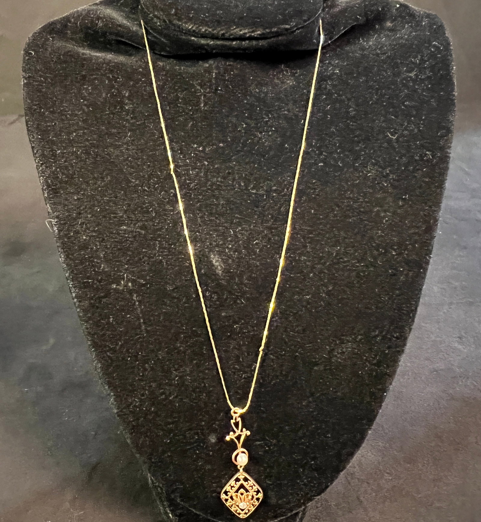 14K Edwardian Diamond and Pearl Lavalier Necklace: A 14K Edwardian lavalier necklace with a diamond and pearl on pendant. Total weight of necklace is 2 grams.