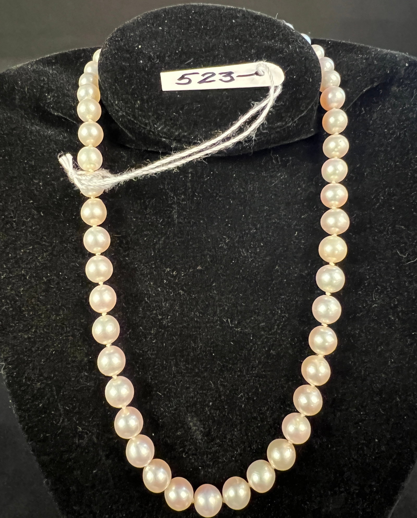 Pearl and 10K Clasp Necklace: A pearl and 10K clasp necklace measuring 16" long.