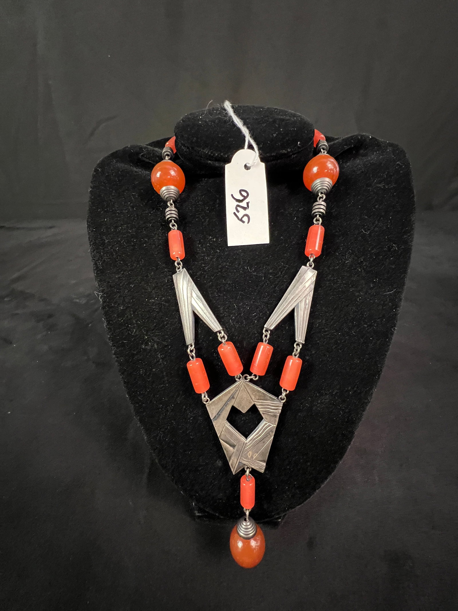 Art Deco Carnelian Necklace: A high quality Art Deco stylized carnelian necklace. It measures 15.5" long.