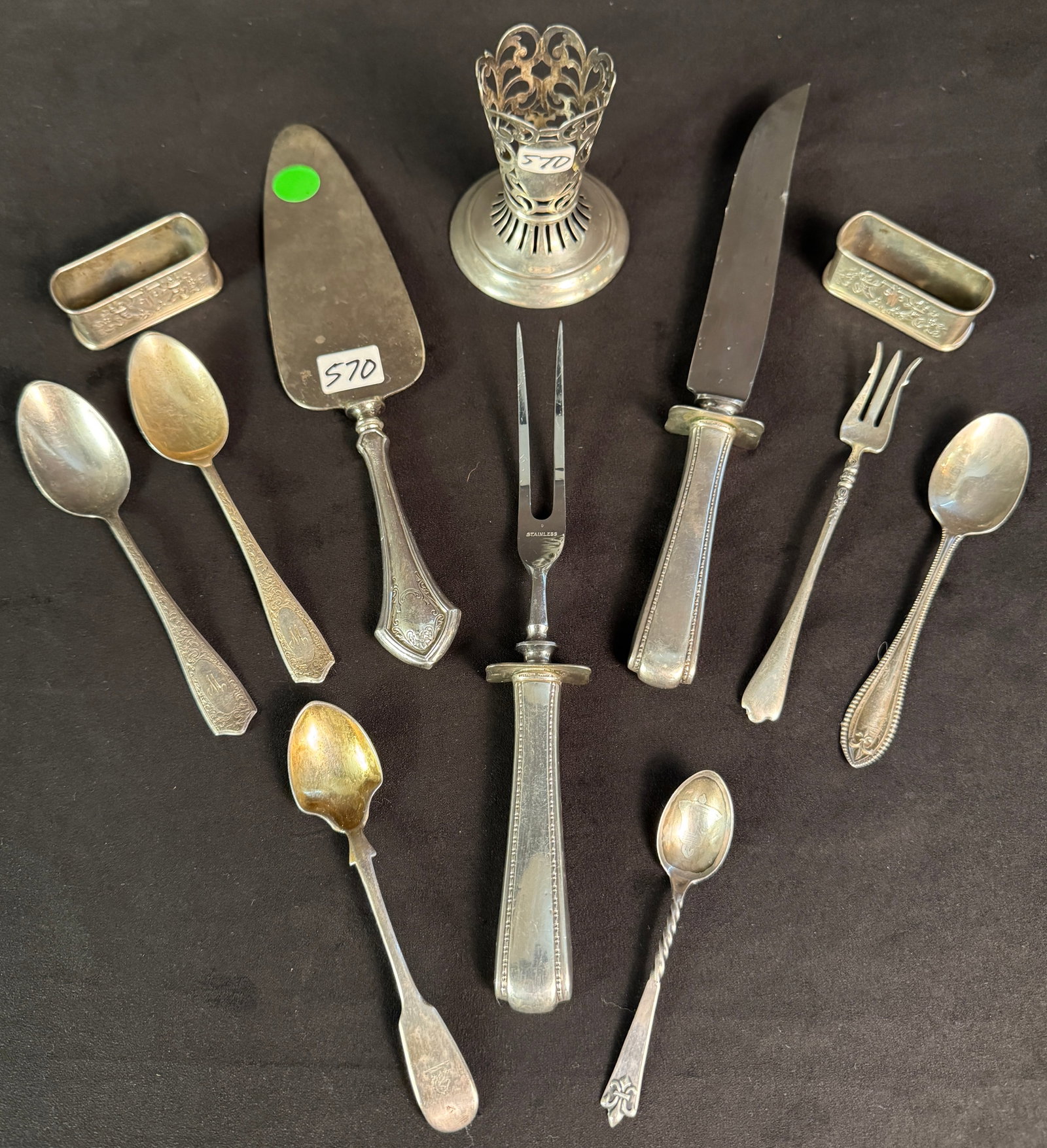 Group of Assorted Antique Sterling Silver: A group of assorted antique sterling silver to include: 2 "W" monogrammed napkin holders by Reed & Barton (27.27 grams), 4 antique teaspoons (73 grams), seafood fork (16.49 grams), soup spoon (23 gram