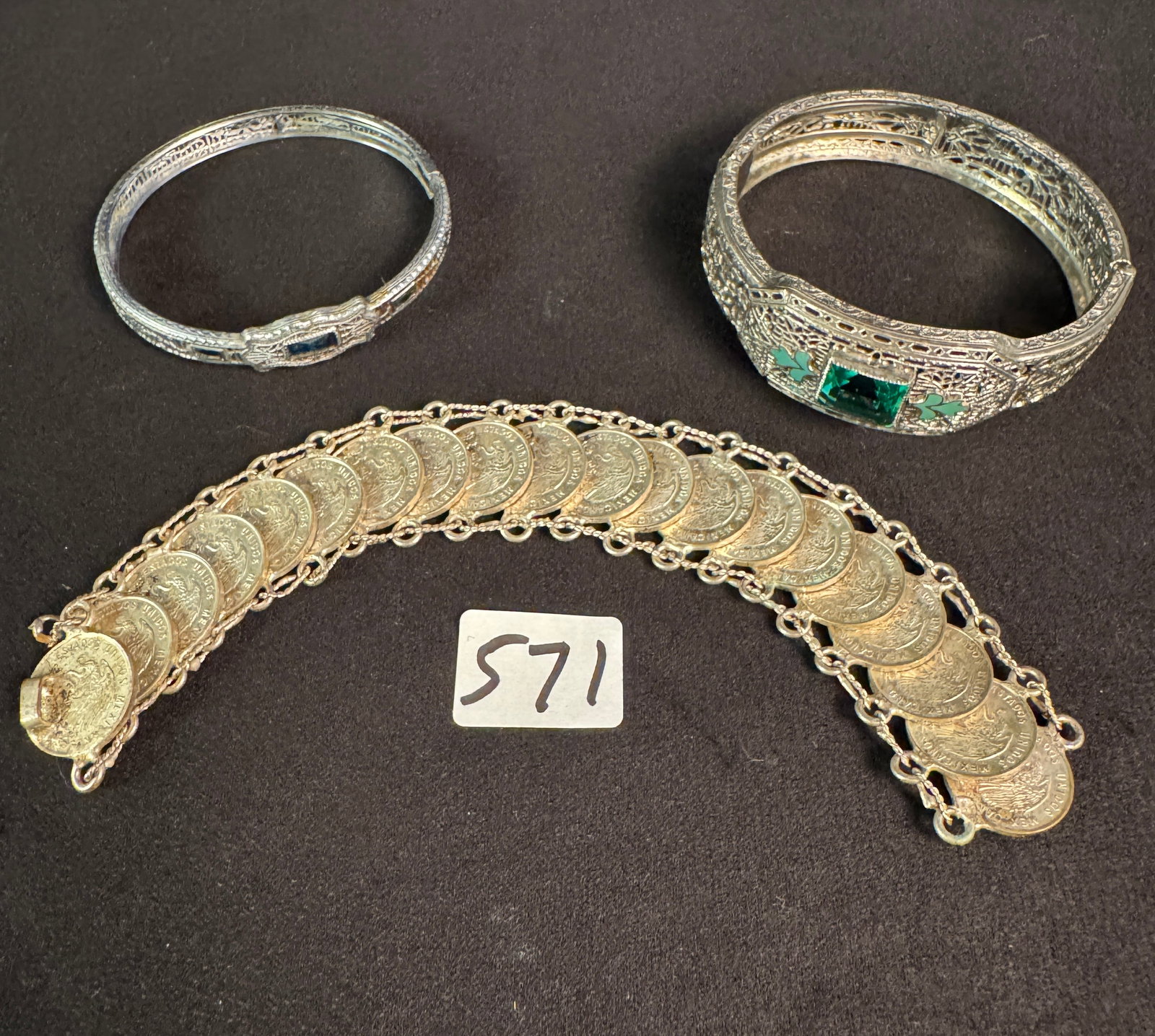 Two Art Deco Filagree Cuffs and Mexican Coin Bracelet: A lot to include 2 beautiful filagree cuff bracelets with glass stones, one features enameling, and a Mexican coin bracelet with linked 1963 Centavo coins.