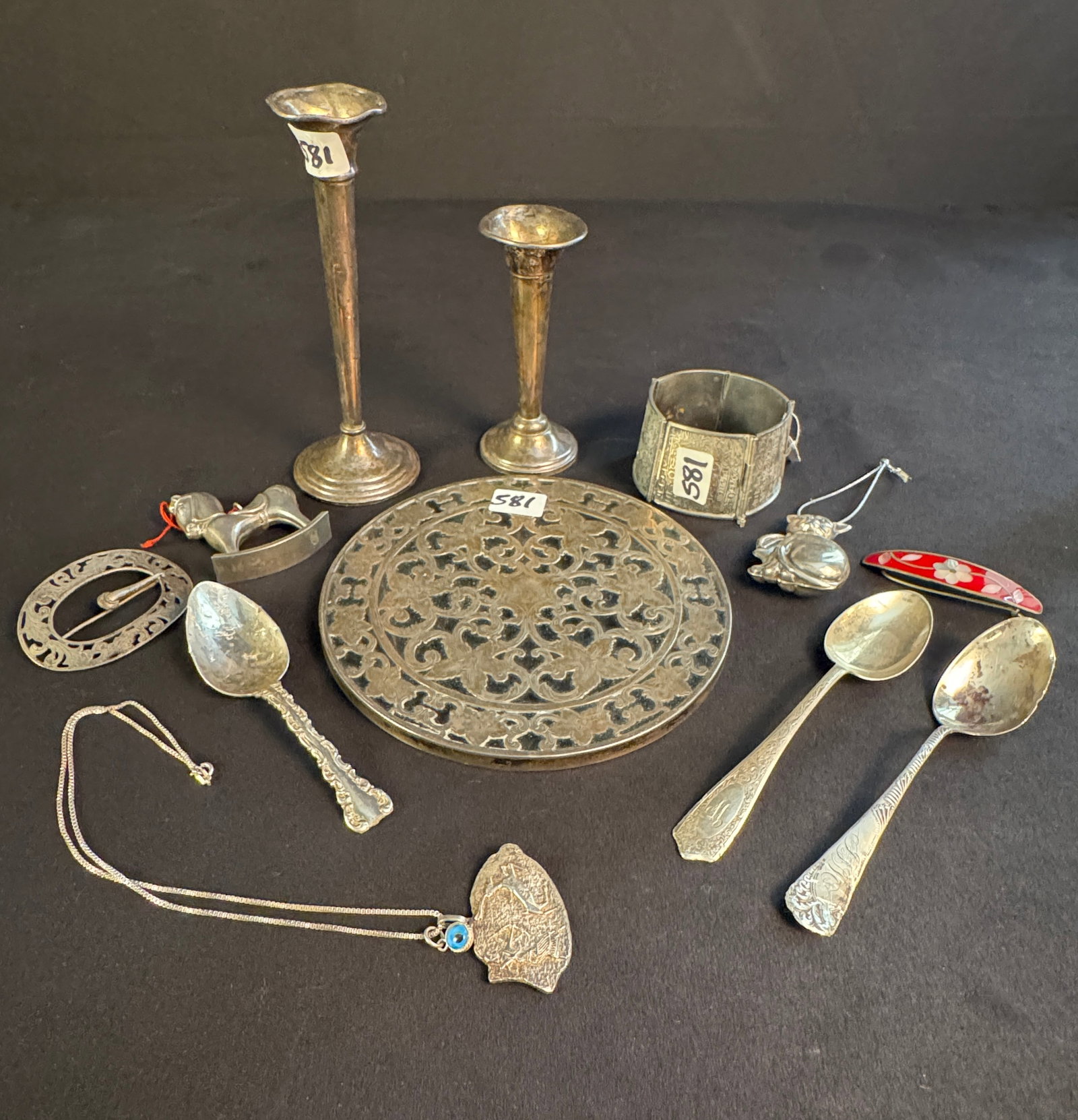 Large Group of Sterling to include Cuff Bracelet, Brooch and More: A large group of assorted sterling to include a high quality cuff bracelet with hieroglyph decorations, an Edwardian belt brooch, an inlaid mother of pearl and stone hair barrette, a necklace with lar