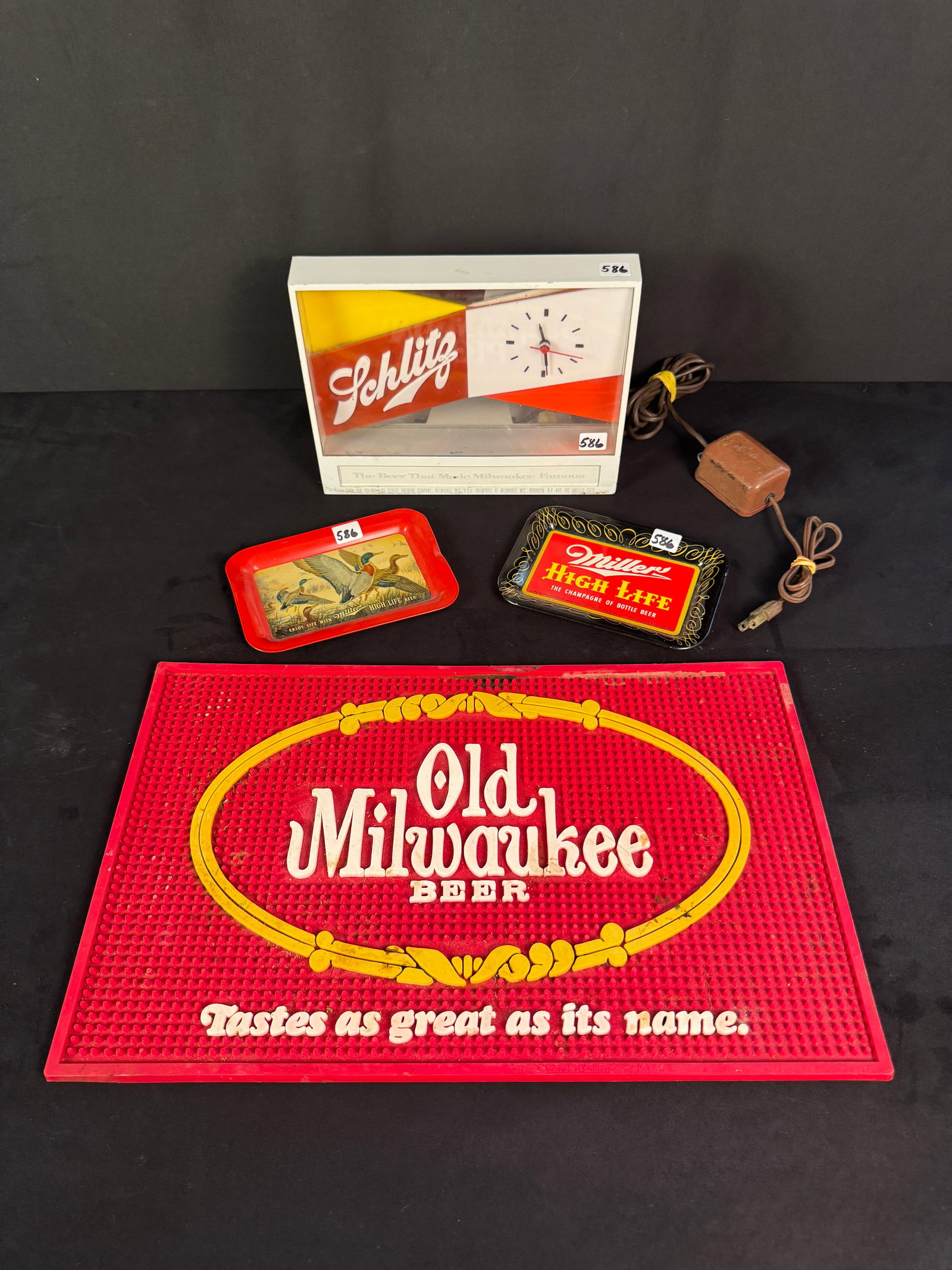 Vintage Brewerianna Group - Schlitz Clock, Miller Tip Trays, More!: A group of vintage Brewerianna to include a 1955 Light up Schlitz table clock c.1955 (it measures 7.5" tall X 10" across X 2.5" deep), 2 tin litho Miller tip trays c.1950s that feature the Miller Logo
