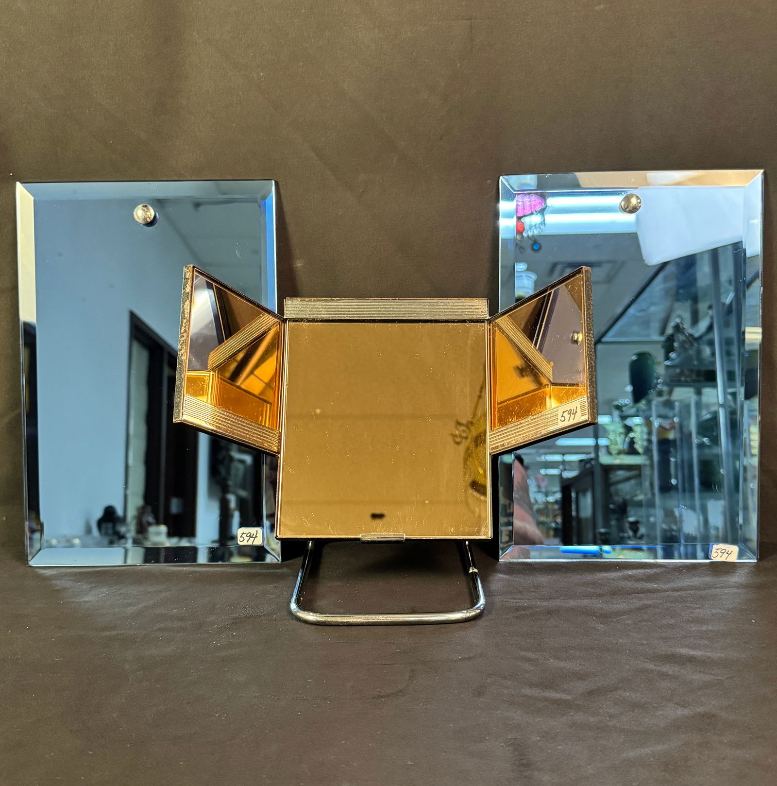 Art Deco Colored Mirrors Group c1920/30's: A group of Art Deco colored mirrors to include 2 matching beveled blue glass wall mirrors (12" tall X 8" across) in excellent condition, and a vanity top tilting triptych pink mirror with chrome base