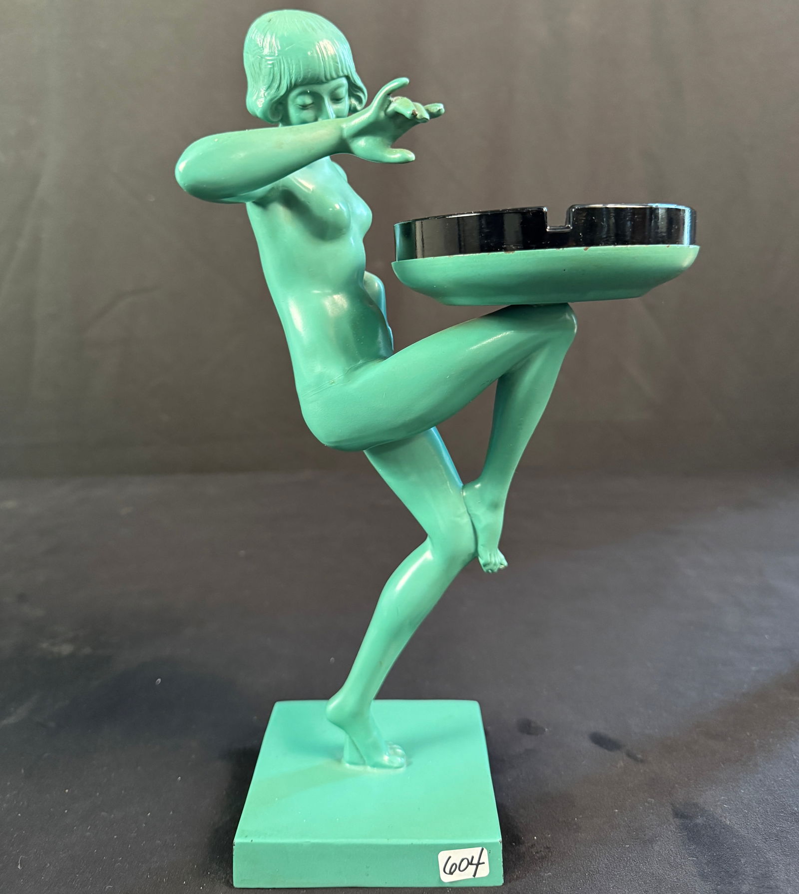 Art Deco Frankart Figural Dancing Nymph Ashtray c1927: This Art Deco dancing nude nymph ashtray c.1927 is by Frankart is in excellent condition and has its original black glass ashtray. It measures 13.5" tall X 7.5 across X 4" deep.