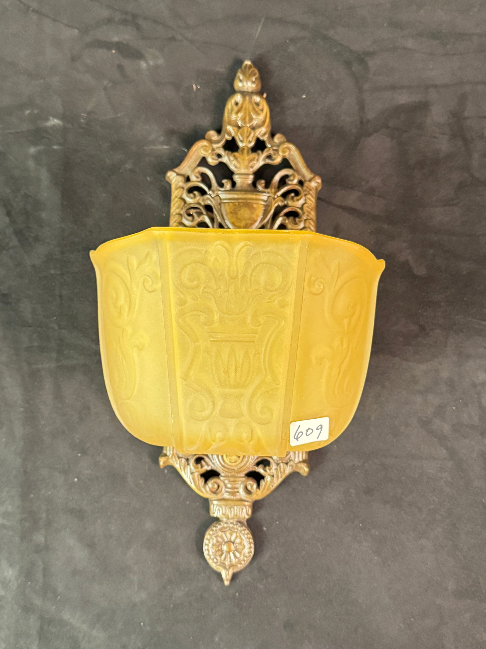 Beaux Arts Transitional Slip Shade wall Sconce c1920's: Beaux Arts Transitional Slip Shade wall Sconce c1920's This 1920's Beaux Arts transitional exaggerated size wall sconce has a molded champaign colored satin glass slip shade with an urn and scrollwork