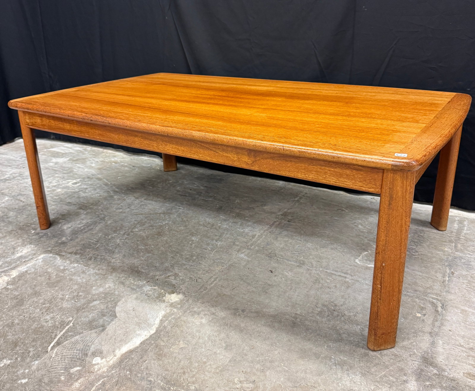 Mid Century Teak Coffee Table C1960's: A Mid Century Modern rectangular teak coffee table with rounded corners and removable legs in excellent condition. It measures 19" tall X 54" across X 32" deep.