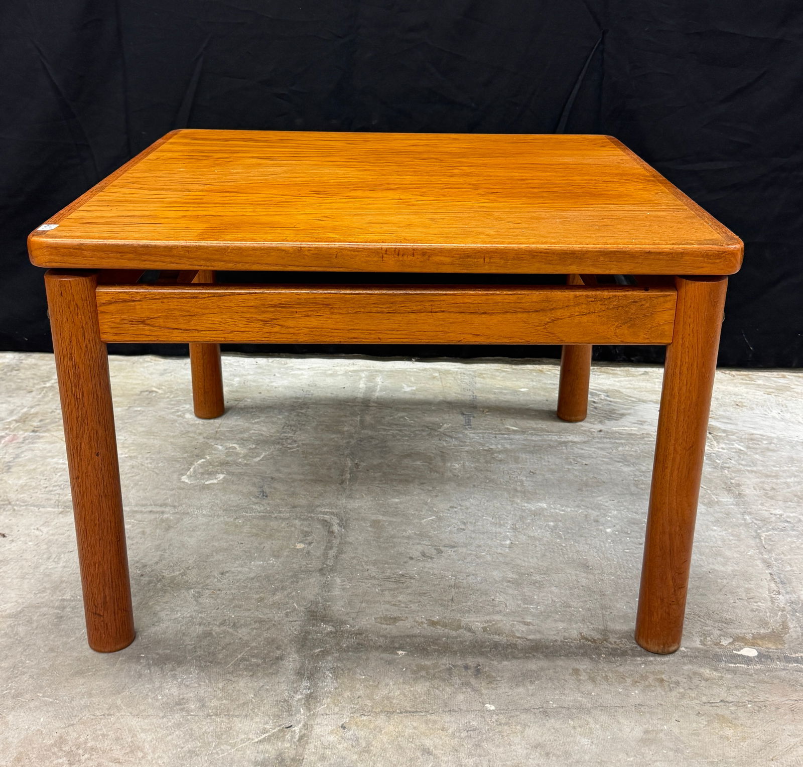 Trioh Mid Century Teak Danish Table C 1977: A Mid Century Modern teak square side table by Trioh of Denmark c.1970's in excellent condition. This table features round legs and 20" tall X 29" across X 29" deep. Measures