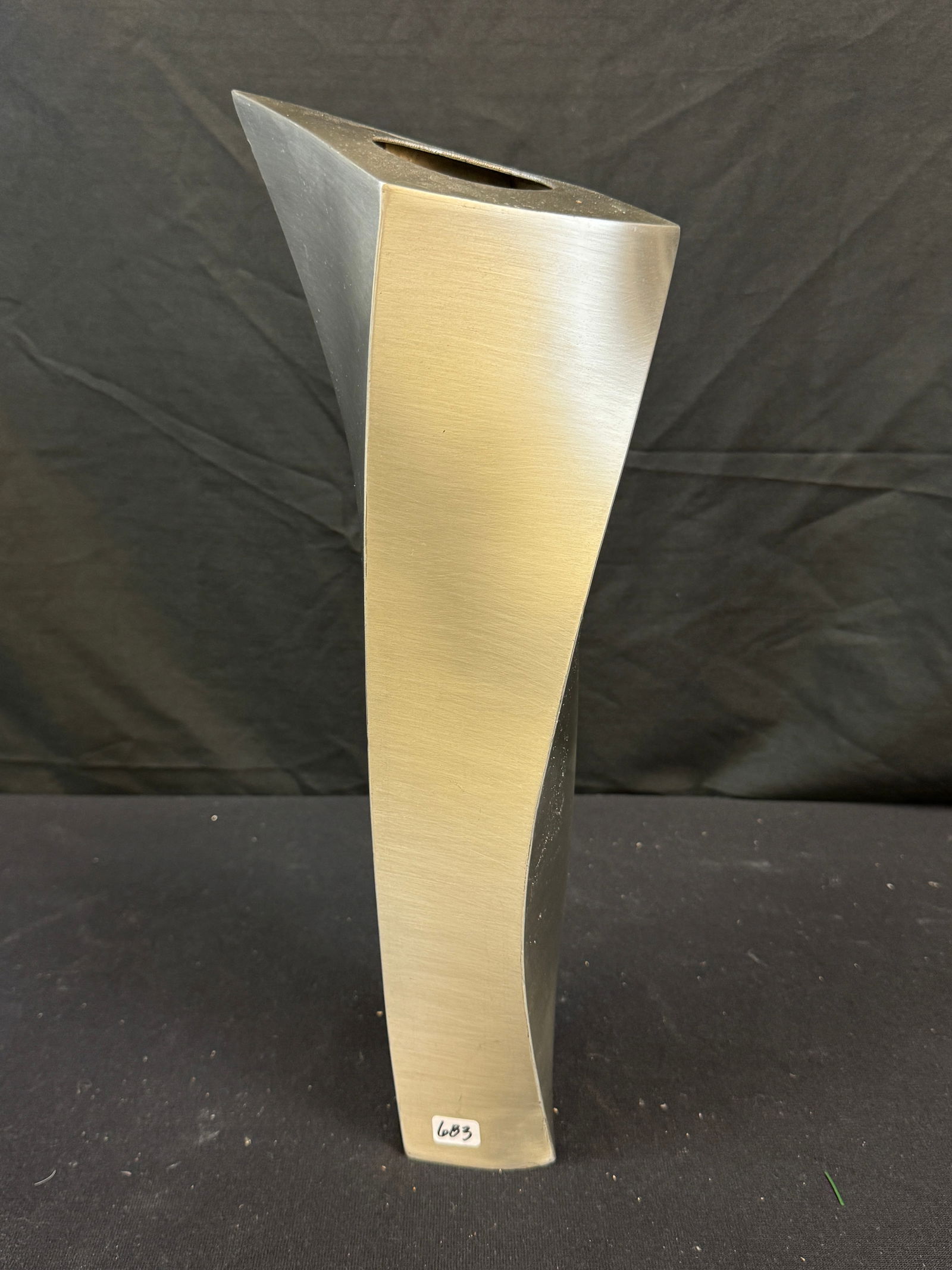 Post Modern Brushed Stainless Steel Twisted Vase Signed Miller c1980's: A signed Post Modern twist body brushed stainless steel vase c1980's signed Miller that measures 16" tall X 4" across in good condition (some scratches noted).