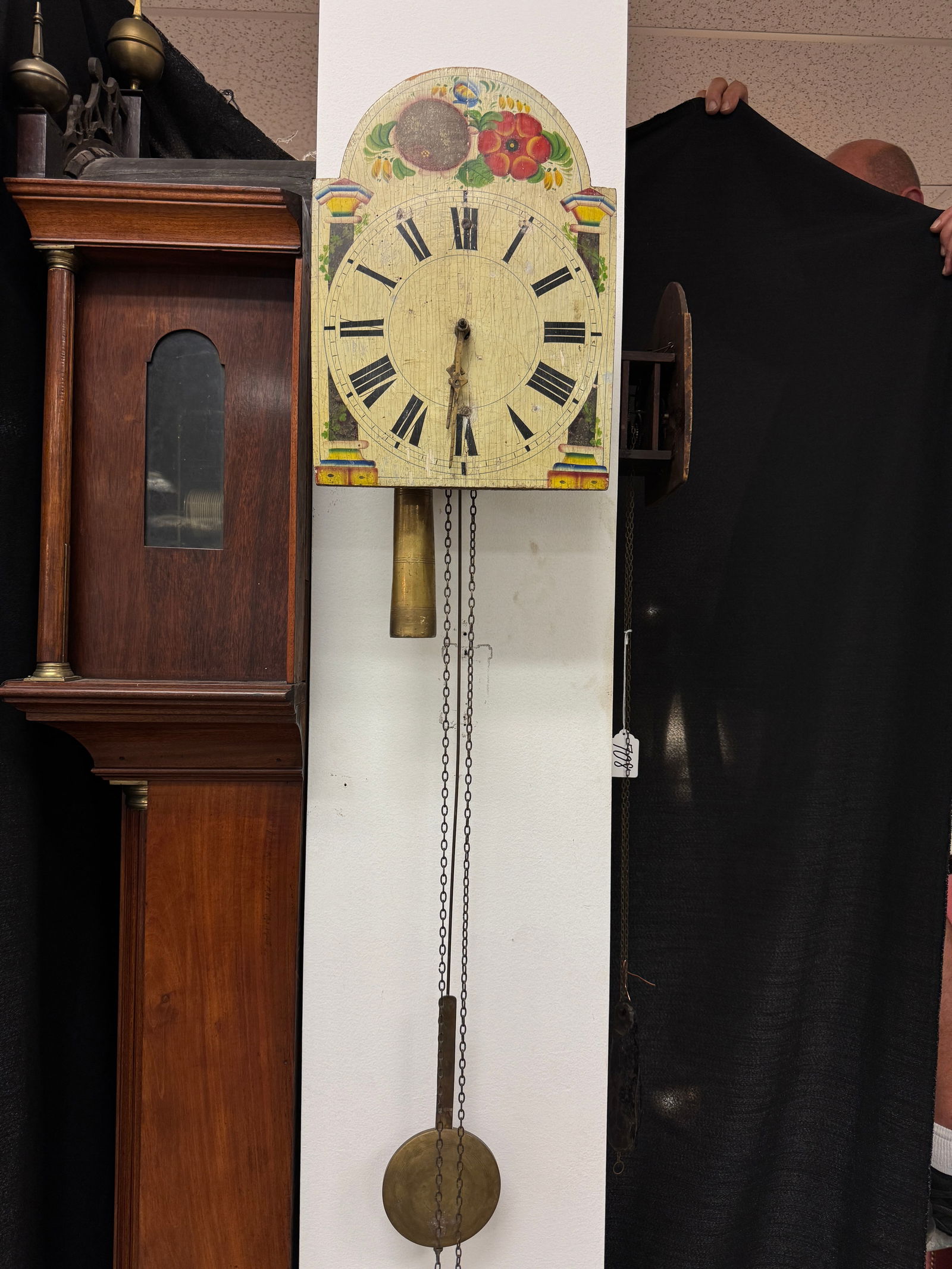 Black Forest Hand Painted Shield Wall Clock: An 18th century Black Forest hand painted floral shield wall clock, face measures 13" tall X 9" across.