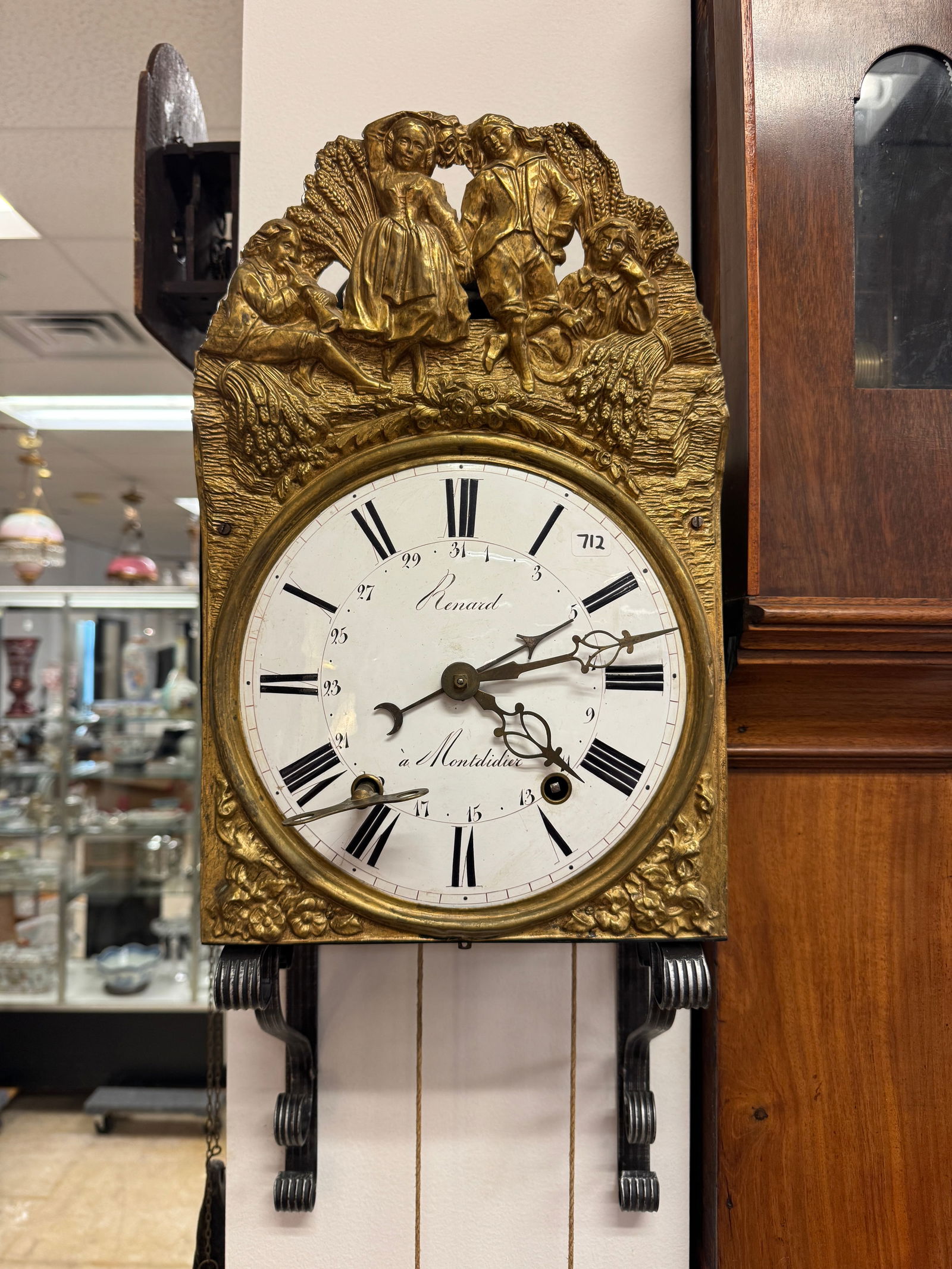French Wall Clock: French brass wag on the wall clock, face is marked Renard Mont Didealla. Clock is sold as is.