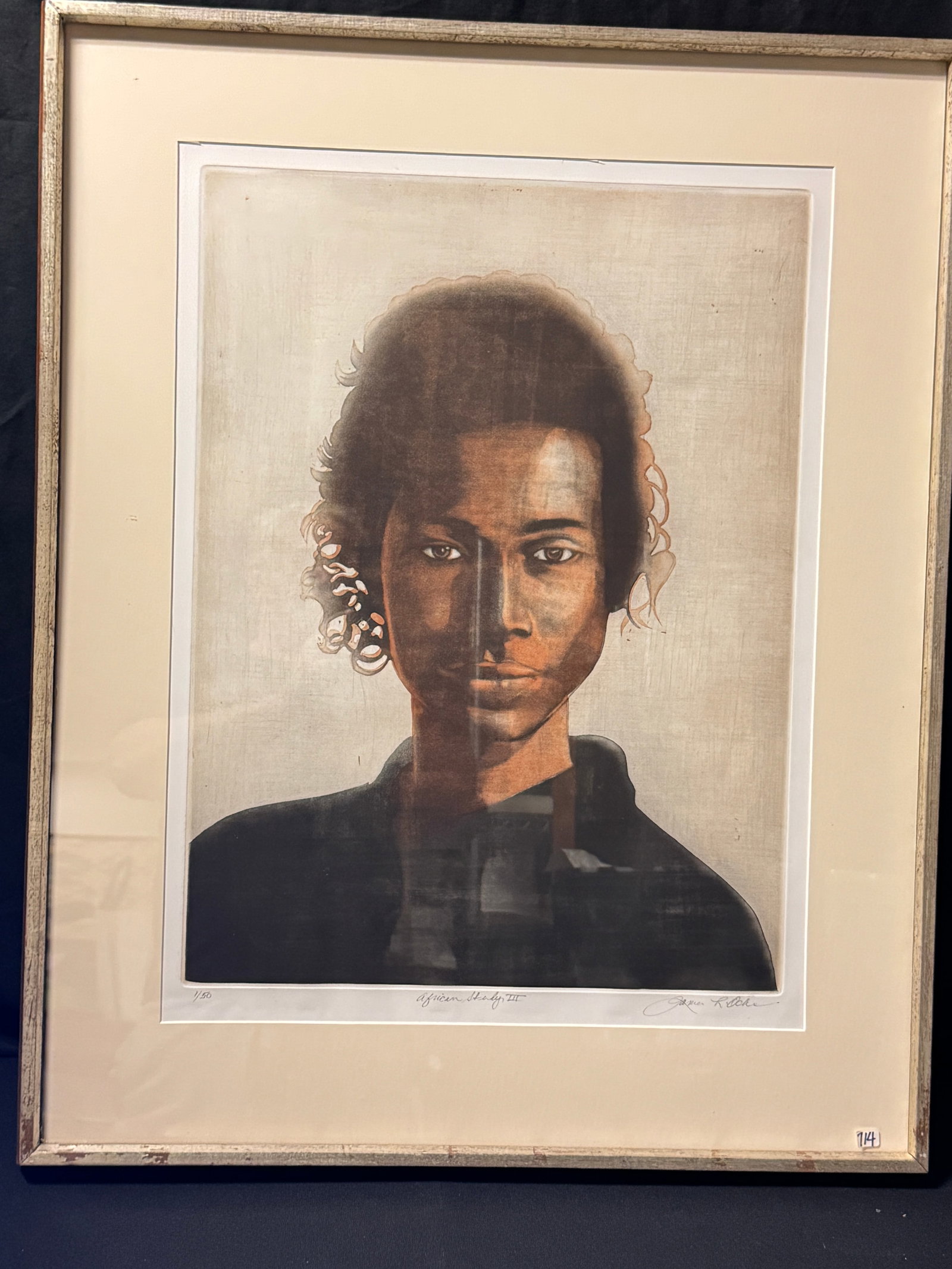 James Ochs Color Itaglio, Signed: This quality framed color intaglio is by listed American Iowa based artist James Ochs (1943-2022). It is titled " African Study III and numbered 1/50. It depicts a beautiful portrait of a young black 