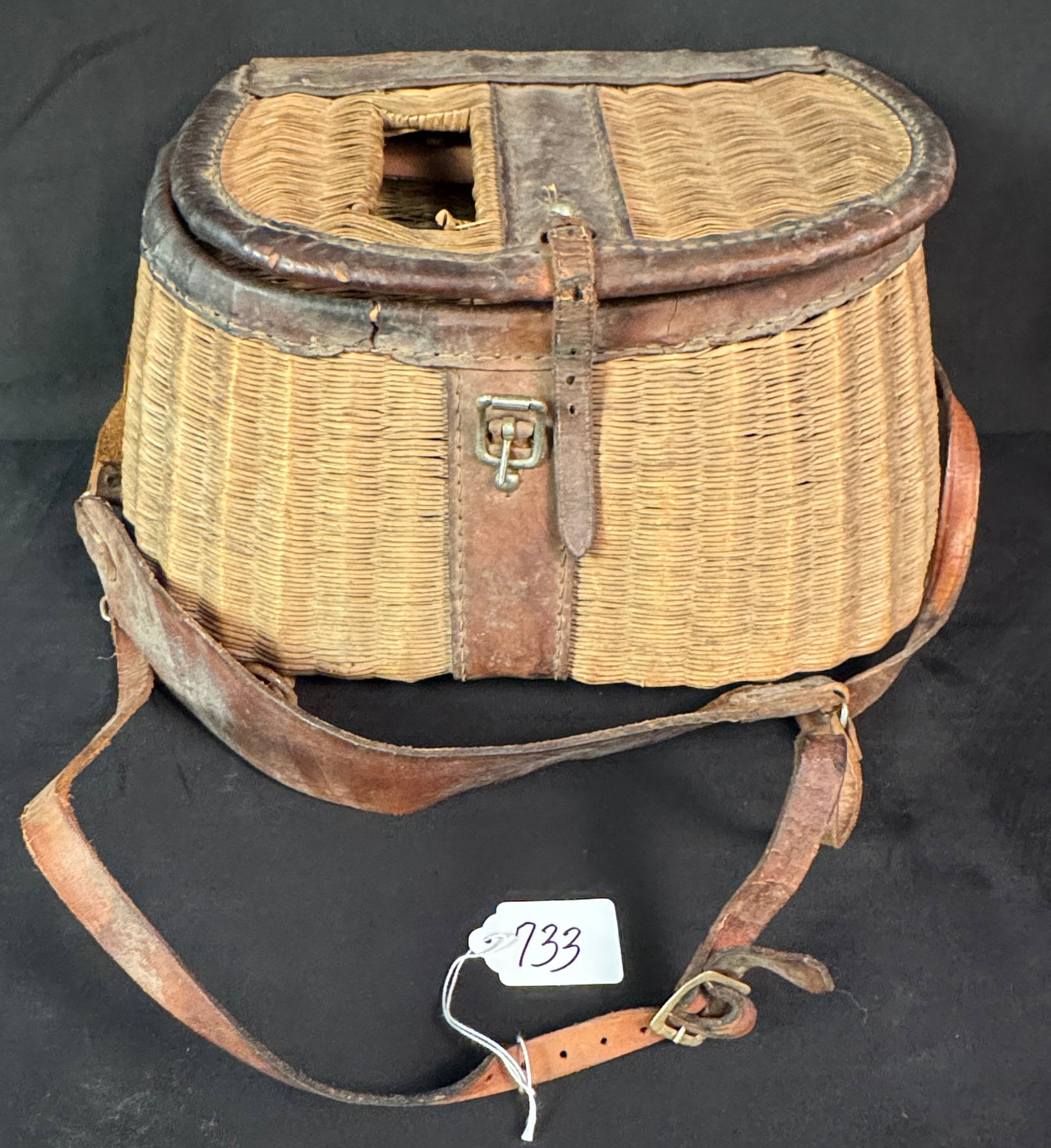Antique Fishing Creel: Antique fishing creel with leather attachments.