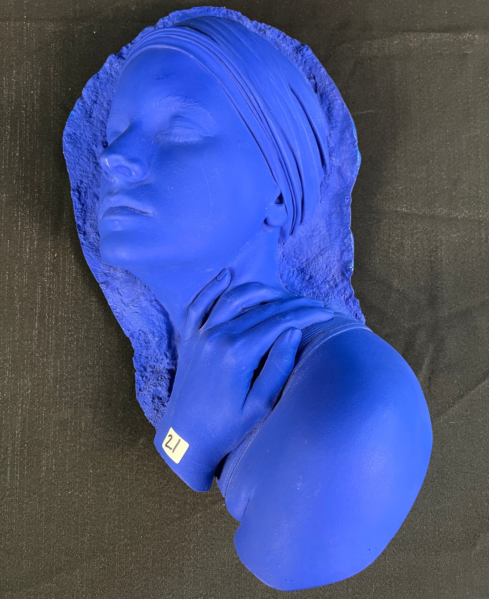 Marc Sijan Original Relief Sculpture: This plaster relief wall sculpture is by Serbian born American artist Marc Sijan. It depicts the face of a young woman in electric blue paint. It is signed on the verso and also has a Sijan tag. It me