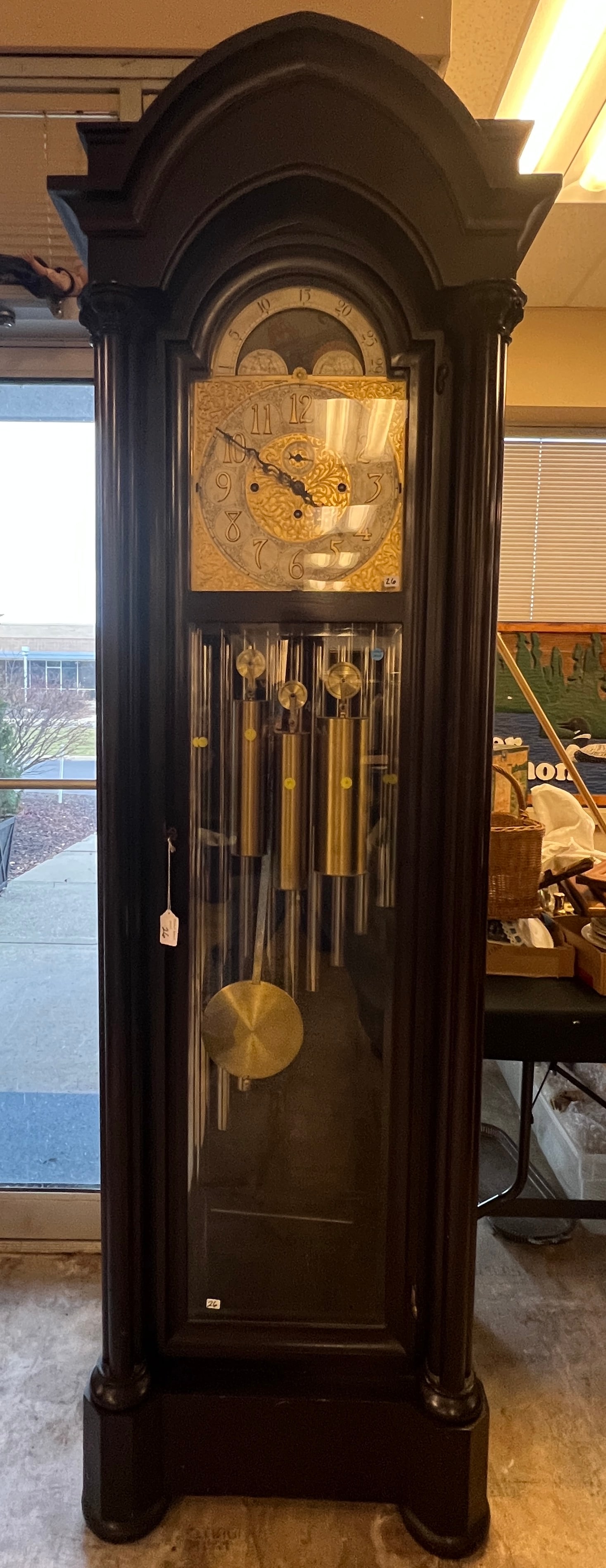 American Chime Clock Co. High Grade Grandfather Clock C.1900: A 1900 American Chime Co. Grandfather clock, their topo f the line model in a Gothic mahogany pillared front case, with beveled glass front and sides, phases of the moon dial with elaborate scrolling.