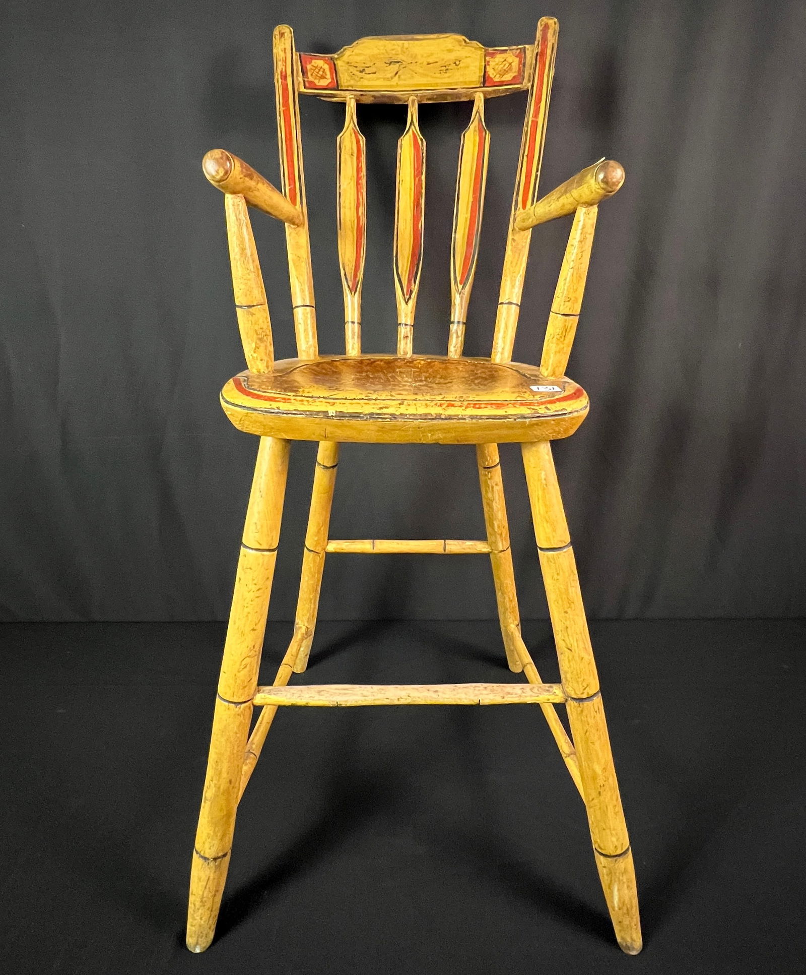 Early American Painted High Chair c1820: An American early country child's painted high chair c1820 with original yellow red and black paint that features a floral painted back rest, painted back splats, banded turned legs and stretcher
