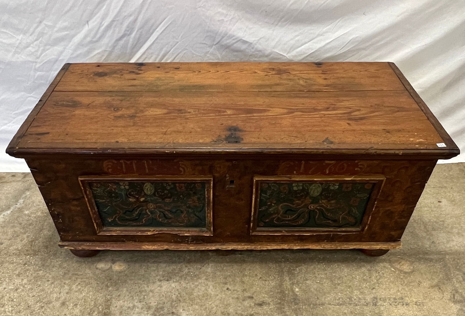 Antique Pine Continental Rosemaled Trunk c1776: An antique Continental rosemaled pine trunk or blanket chest that features floral and ribbon decorations, decorated surface, iron bail handles and original iron lock, till drawer, painted initials and