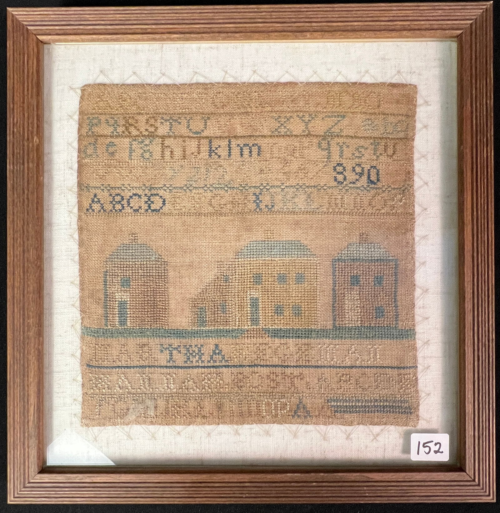 Early American Sampler, c1800s: An early American cross stitch sampler, c1800s, by Martha Wegeman. This quaint sampler features alphabets, houses and buildings, and some decorative elements. In great condition, this framed piece mea