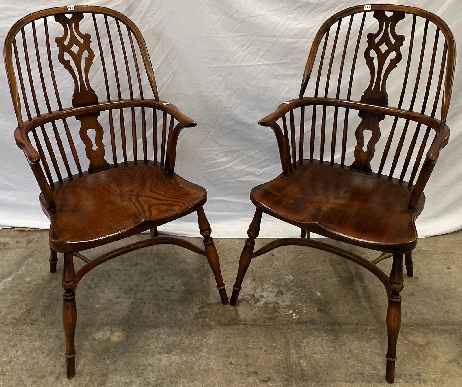 2 Contemporary Windsor Comb Back Chairs: A matching pair of contemporary Windsor comb back chairs measuring 41" tall X 20" X 22" deep.