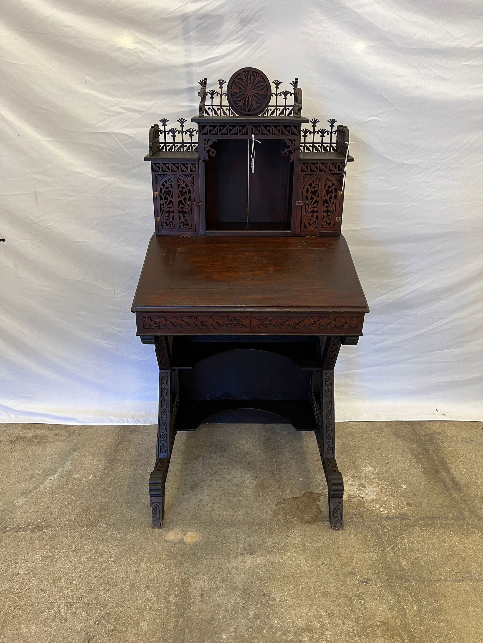 Charles Bacheller Fretwork Davenport Style Desk C 1880s: An elaborately carved fretwork Davenport style desk dating to the 1880s. The desk was made by Charles E. Bacheller (1848-1915) of Massachusetts who was known for his elaborate hand sawn fretwork furni