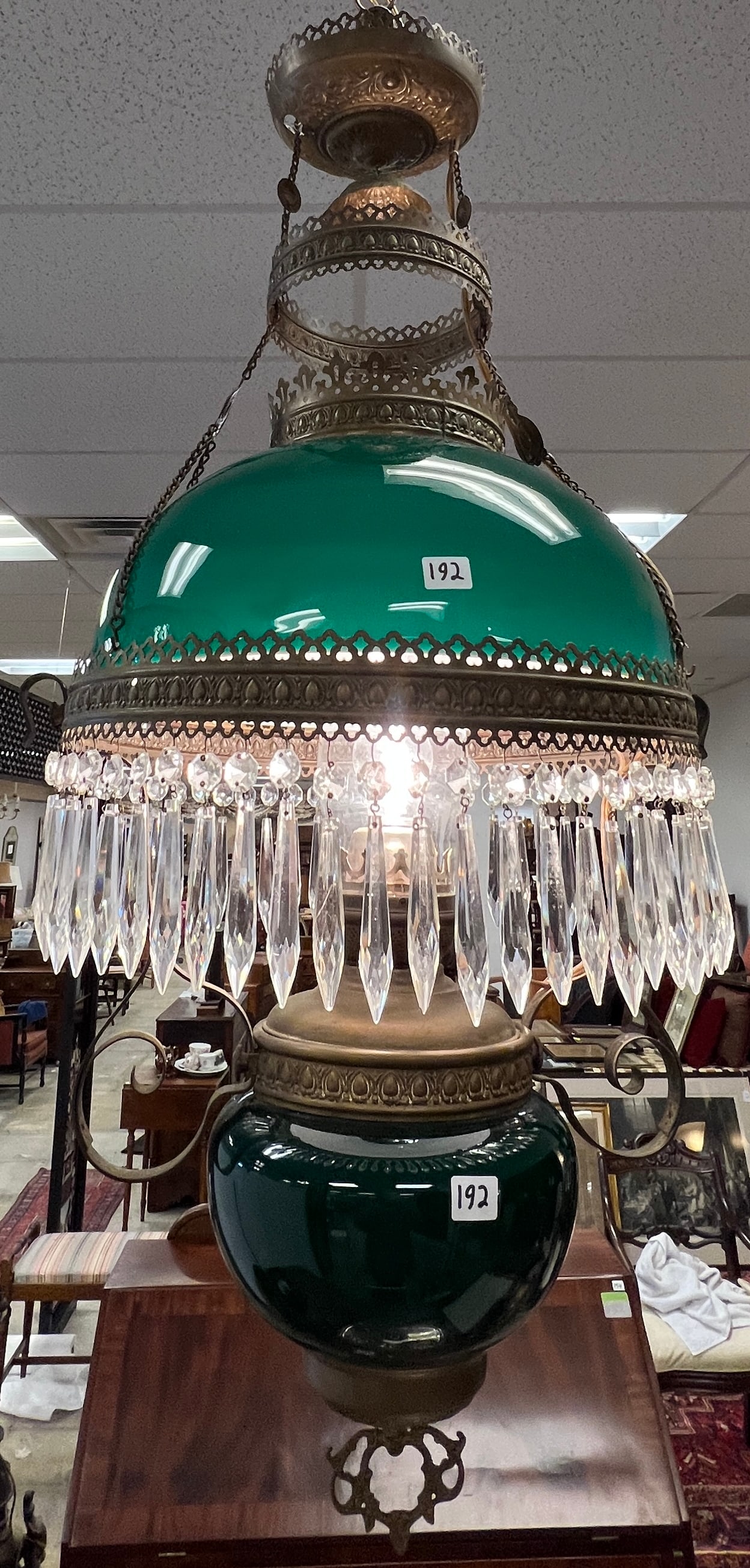 Victorian Green Case Glass Electrified Oil Chandelier: A Victorian electrified hanging oil chandelier that retains matching green case glass font, shade and crystals. Overall in beautiful condition, it measures 36" long.
