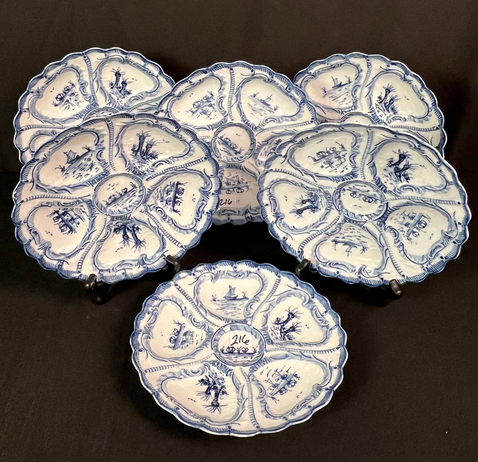 Six Weimar Porcelain Oyster Plates w/ Maritime Delft motif c1900: Six Weimar porcelain oyster plates c 1900 that feature a Delft like blue and white maritime motif in excellent condition. They measure 8.5" across.
