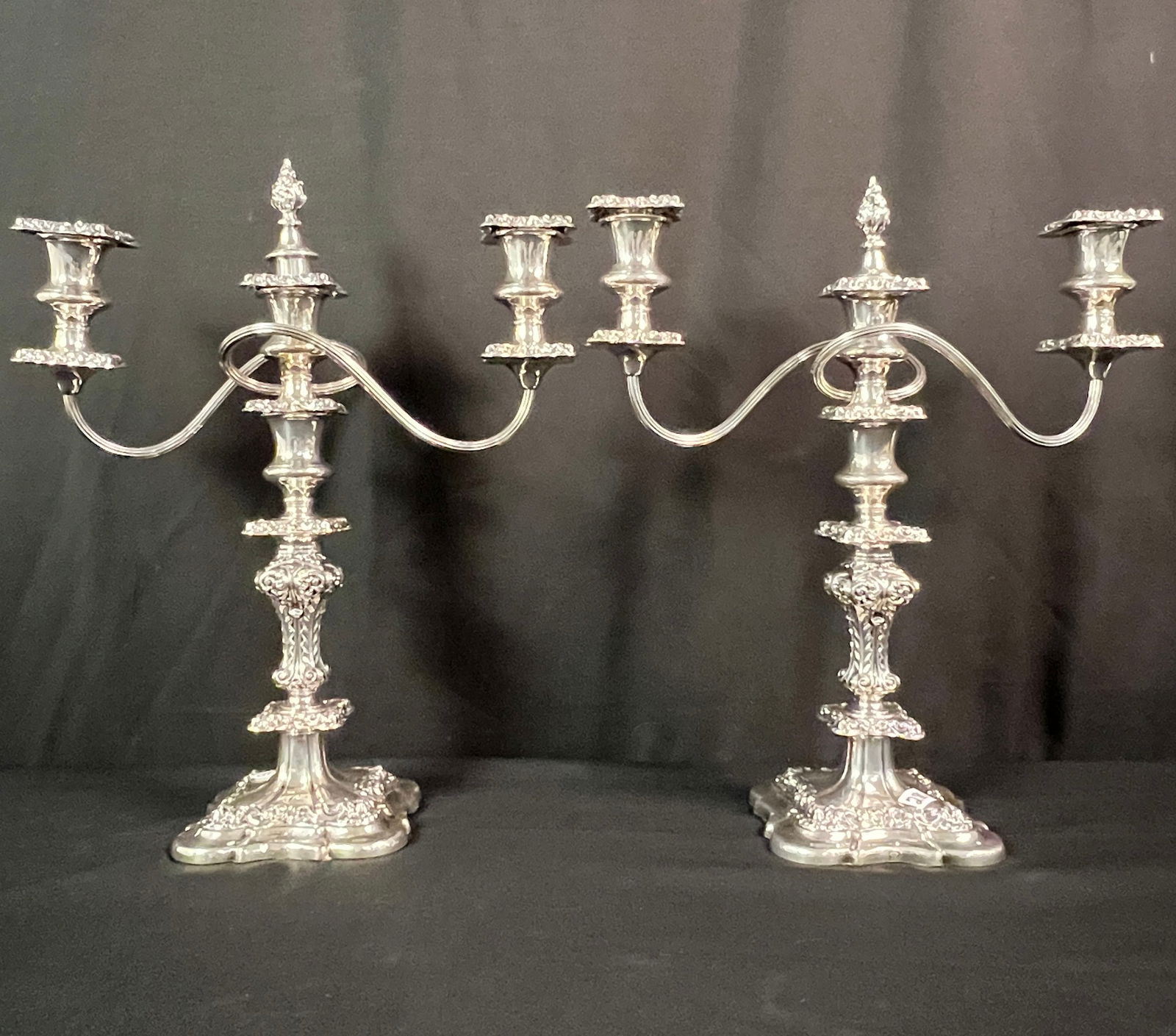 Antique Pair of English Silver Plate Candelabras c. 19th Century: A pair of Barker Ellis ornate floral filigreed and chased, 3 arm heavy silver plate candelabras. With British and Canadian patents, these candelabras come apart and can either be used for single or 3