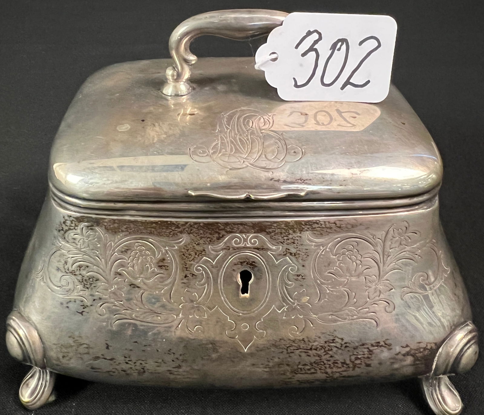 800 Silver Jewelry Casket: An 800 silver Edwardian jewel casket with elaborate chasing and hinged lid in excellent condition. It weighs 454.8 grams.
